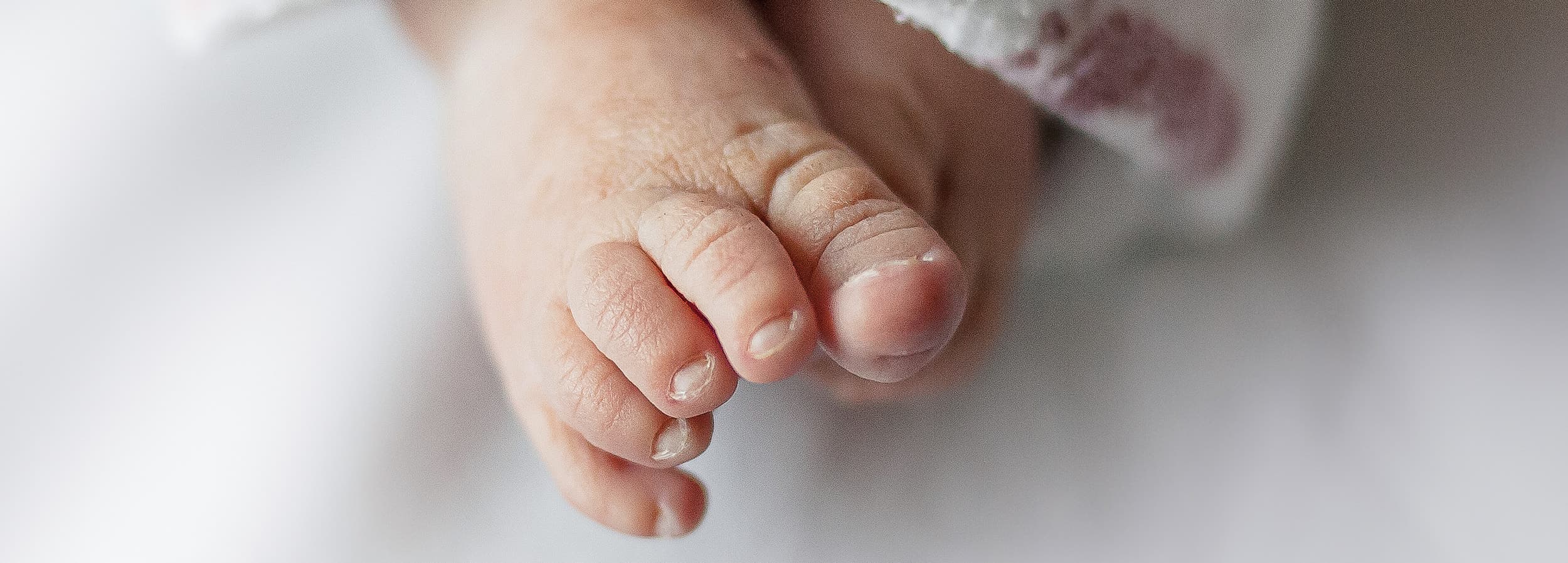 An image of newborn baby toes